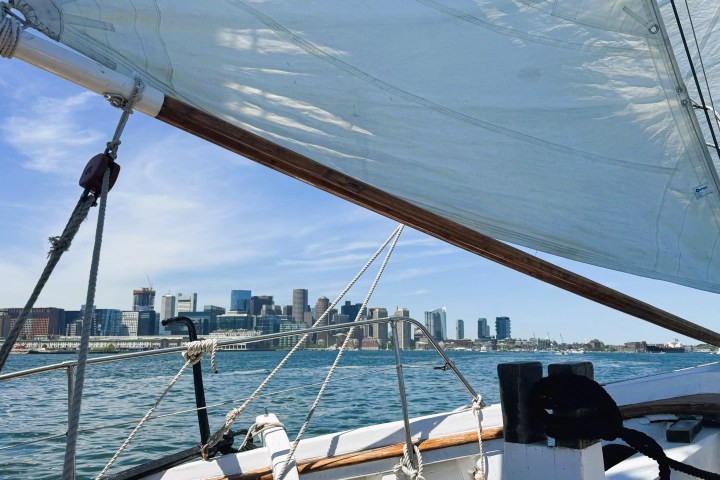 a boat is docked next to a body of water