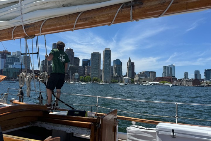 a boat is docked next to a body of water